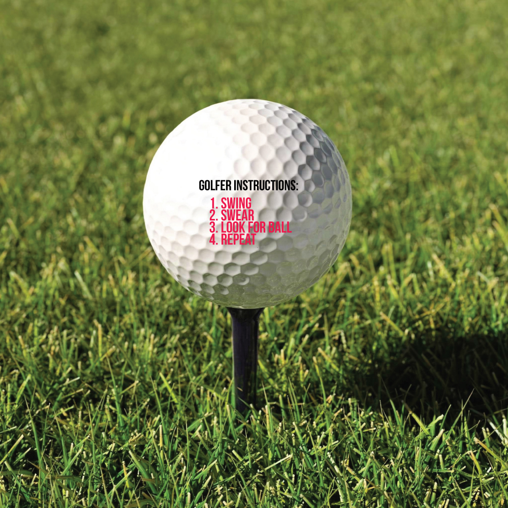 Golfbold med tryk: Golf instructions: 1. Swing - 2. Swear - 3. Look for ball - 4. Repeat